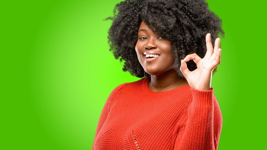 woman holding up OK sign with fingers