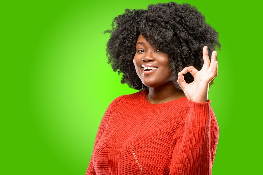 woman holding up OK sign with fingers