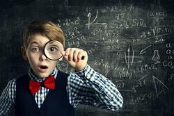 child looking through magnifying glass