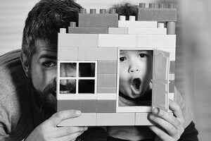 child and son playing with toy