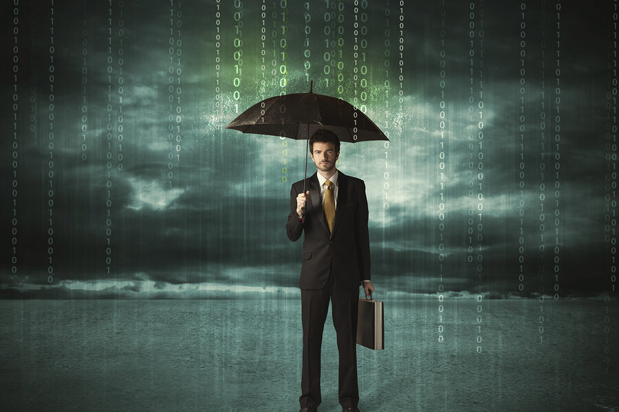 Business man standing with umbrella data protection concept on b